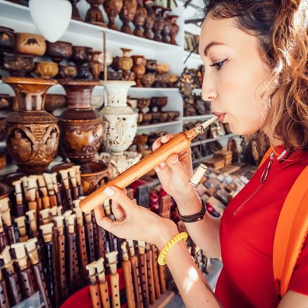 Armenia Yerevan Woman Inspects A Duduk Traditional Armenian Musical Wooden Instrument
